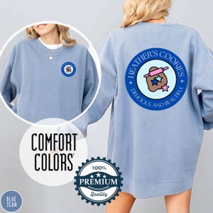 Blue Jean Comfort Colors sweatshirt with custom logo – front and back view of branded merch crewneck in light blue jean color.