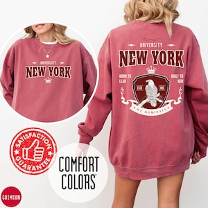 Crimson Comfort Colors crewneck sweatshirt featuring a custom logo design – shown front and back, branded merch in rich red.