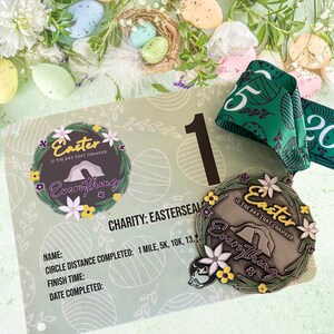 May include: A bronze-colored medal with a wreath of flowers and the text "Easter is the day that changed everything" around a depiction of a cave. The medal is on a green and white card with the text "Charity: Easterseal" and a space for a name, distance completed, finish time, and date completed.