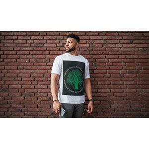 May include: White t-shirt with a black square graphic featuring a green tree and the text "may you live as long as you want and never want as long as you live."