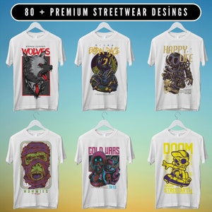 May include: Six white t-shirts with different graphic designs. The designs include a wolf, a robot, a monster, a skull, a mummy, and a skeleton. The text on the shirts includes "Wolves", "Born Pace", "Happy Life", "Gold Wars", "Mummies", and "Doom Urban Streetart".