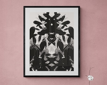 May include: Black and white framed print of a symmetrical design featuring overlapping leaves and branches.