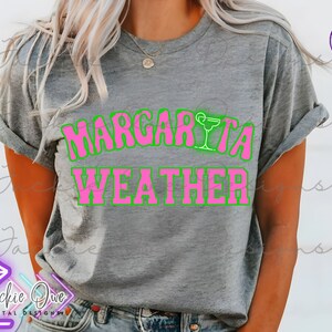 May include: A gray t-shirt with the text "Margarita Weather" in pink and green letters. A margarita glass icon is above the word "Margarita".