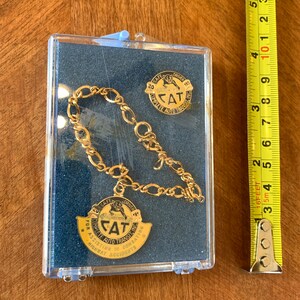 C.A.T. - Vintage Auto Transit Safe Driver Pendant & tie clip 20yr safety award.