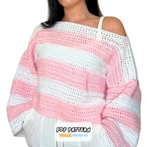 May include: A white, pink, and white striped crochet sweater with an off-the-shoulder design. The sweater has long sleeves and a loose fit. The text "PDF PATTERN HYGGE CROCHET CO." is visible at the bottom.