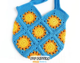 May include: A handmade crochet tote bag featuring a pattern of square motifs. Each square contains a bright yellow and orange sunburst design centered on a vibrant blue background. The bag includes a matching blue crochet strap for carrying.