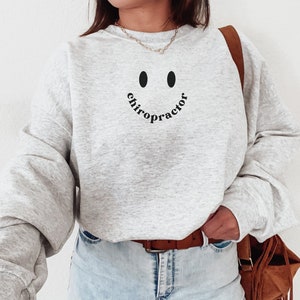 Moletom Quiroprático Presente de Formatura Quiroprático Camisa Quiroprática Sorriso Chiro Gola Redonda Coluna Vestuário de Escritório Quiroprático Pulôver Bonito Quiroprático