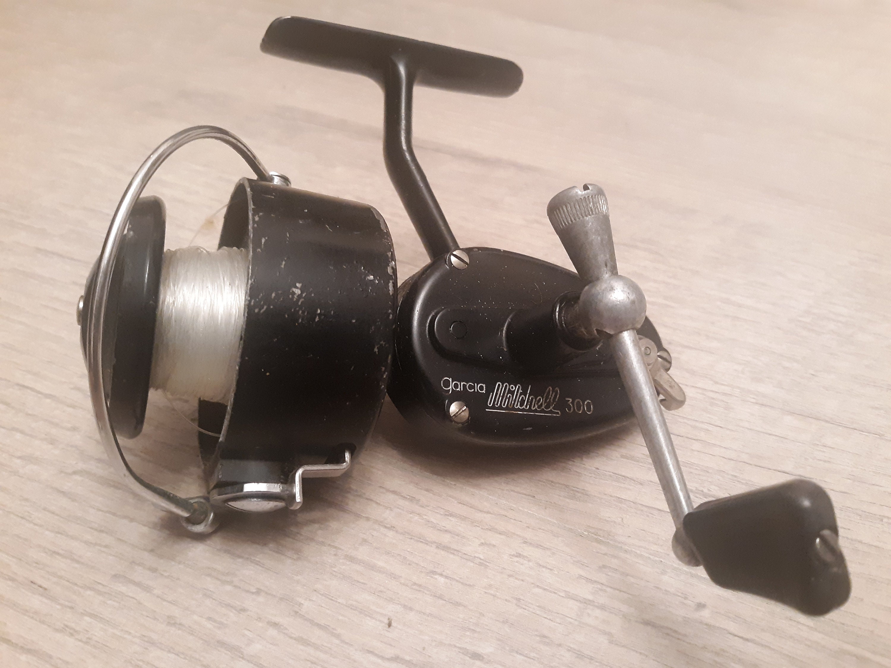 Two vintage Garcia Mitchell spinning fishing