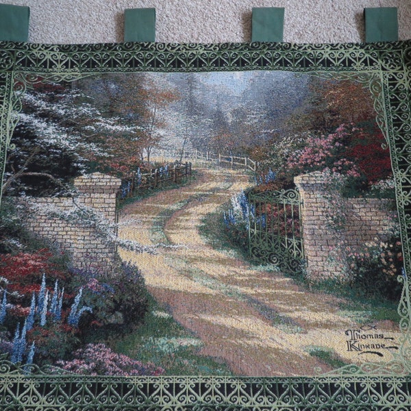 Vintage hanging wall tapestry lined including wooden display depicting Thomas Kinkade artwork- “Spring Gate”