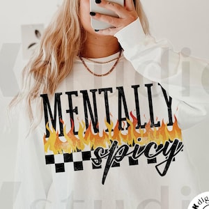 May include: White long-sleeve shirt with the text "MENTALLY spicy" in black lettering with flames and a checkered pattern.