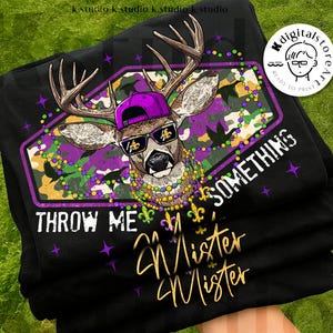 May include: Black t-shirt with a deer design wearing sunglasses, a purple cap, and a beaded necklace. The text reads "THROW ME SOMETHING Mister Mister" with Mardi Gras symbols. The shirt is a digital download.