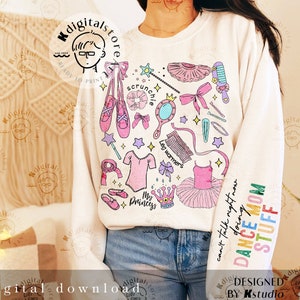 May include: A white sweatshirt featuring a colourful design of dance accessories, including ballet shoes, a crown, a tutu, and the text "My Princess". The text "Can't talk right now doing DANCE MOM STUFF" is on the sleeve.
