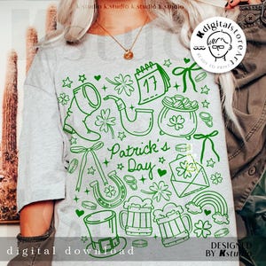 Pode incluir: Camiseta cinza claro com um design verde para o Dia de São Patrício. O design inclui um calendário com o número 17, trevos, um pote de ouro, um arco-íris e as palavras "Patrick's Day". As palavras "download digital" também são visíveis.