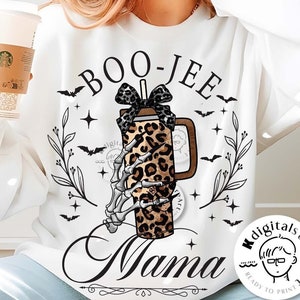 May include: White sweatshirt with a Halloween-themed graphic. The design features the words "Boo-Jee Mama" above a leopard print coffee cup with a skeleton hand, bats, and floral accents. The words "digital download" are at the bottom.
