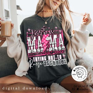 May include: A gray sweatshirt with a pink graphic that says "Just a Mama out here trying not to raise assholes".