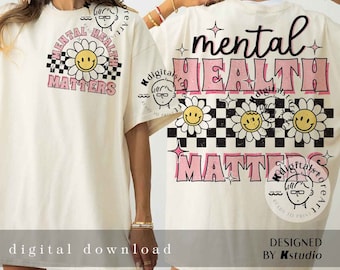 May include: A white t-shirt with a pink and black graphic design that says "mental health matters". The graphic features a checkered pattern, daisies, and smiley faces.