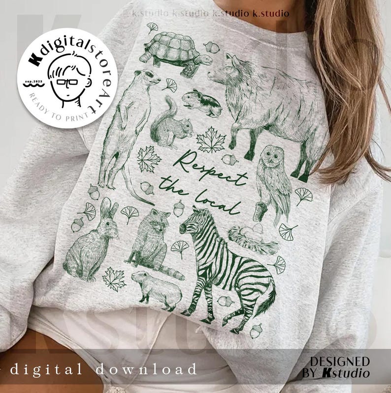 May include: A light gray sweatshirt featuring a green illustration of various animals, including a zebra, owl, and rabbit, with the text "Respect the Local." The design includes leaves and acorns. The words "digital download" and "designed by kstudio" are also visible.