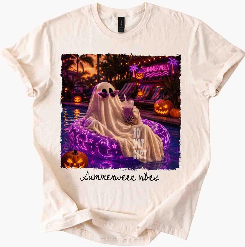 May include: Cream-colored t-shirt featuring a graphic of a ghost wearing sunglasses, relaxing in a pool on a purple inflatable. The image includes pumpkins, palm trees, and the text "Summerween vibes" and "DO NOT COPY".