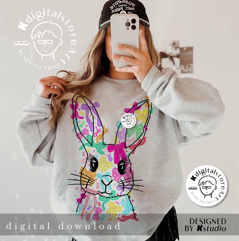 May include: A gray sweatshirt with a colorful bunny rabbit design. The bunny is made up of a variety of colorful bows. The sweatshirt has the text "digitalstoreart" and "ready to print" on it.