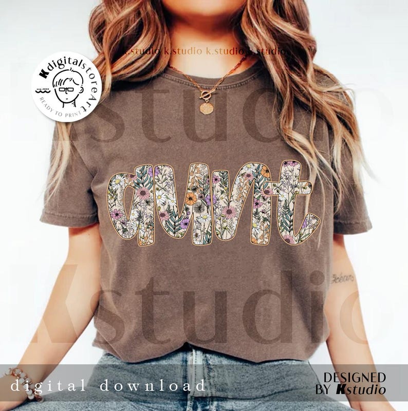 May include: A brown t-shirt with a floral design that spells out "aunt".