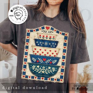 May include: Dark gray t-shirt featuring a graphic of stacked bowls with heart and floral designs. The bowls are in shades of blue and cream, with a blue and red border. The text "digital download" is at the bottom.