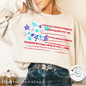 May include: A white sweatshirt with a red, white, and blue American flag design. The flag is made up of red and white stripes with blue stars in the top left corner. The stars are drawn in a childlike style.