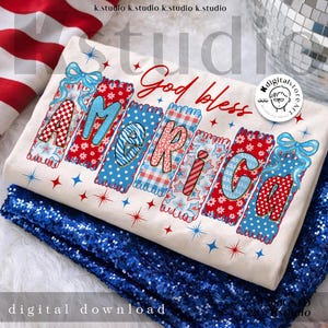 May include: A cream-colored t-shirt with the word "AMERICA" in colorful, patriotic designs. The text "God bless" is above the word "AMERICA" in red script. The shirt is on a bed of blue sequins. The words "digital download" are at the bottom.