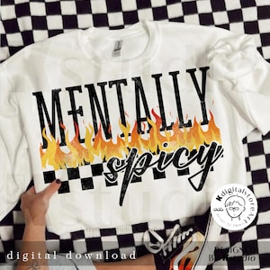 May include: White sweatshirt with black text that reads "Mentally Spicy" with flames and a checkered pattern.