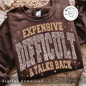 May include: A brown sweatshirt featuring the text "EXPENSIVE DIFFICULT & TALKS BACK" in gold and leopard print. The words "digital download" are at the bottom left of the image.