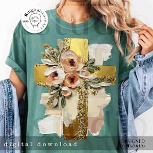 Może przedstawiać: Zielona koszulka z nadrukiem złotego krzyża ozdobionego brzoskwiniowymi i białymi kwiatami oraz złotymi brokatowymi akcentami. U dołu napis "digital download". Projekt Kstudio.