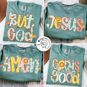 May include: Four teal-colored sweatshirts with floral and text designs. The text includes "BUT GOD", "JESUS", "AMEN", and "GOD IS GOOD". Each design features a unique floral pattern in various colors, including yellow, pink, and orange.