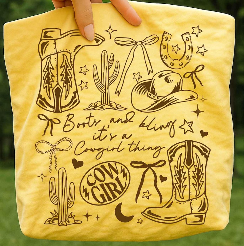 May include: Yellow tote bag with brown illustrations of cowboy boots, a cowboy hat, cactus, horseshoe, and bows. Text reads "Boots and bling it's a Cowgirl thing" and "Cowgirl".