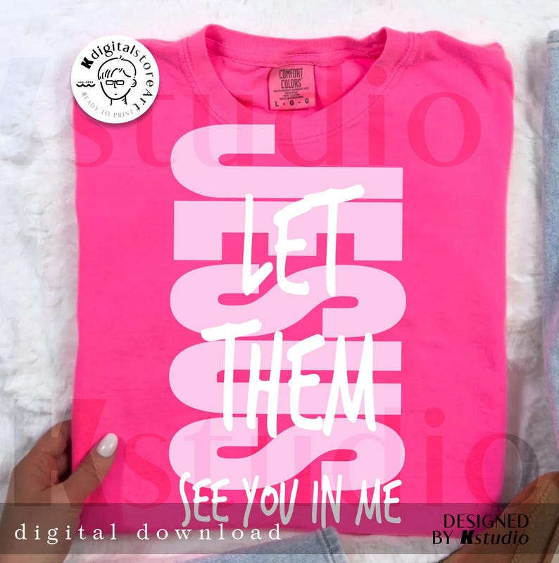 May include: A hot pink t-shirt with the words "JESUS LET THEM SEE YOU IN ME" in a white, bold font. The shirt has a Comfort Colors tag and a digital download logo.