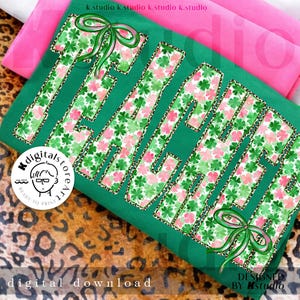 May include: Green t-shirt with the word "TEACH" in large letters. The letters are filled with a shamrock and pink floral pattern, outlined with a leopard print. Green bows accent the design. The words "digital download" are at the bottom.