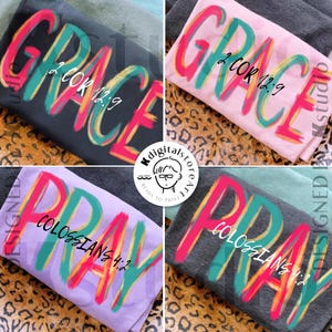 May include: Four t-shirts with inspirational messages. The shirts are in various colors, including black, pink, purple, and gray. Each shirt features a different word: "GRACE" or "PRAY", with corresponding Bible verses in a colorful, brushstroke style.