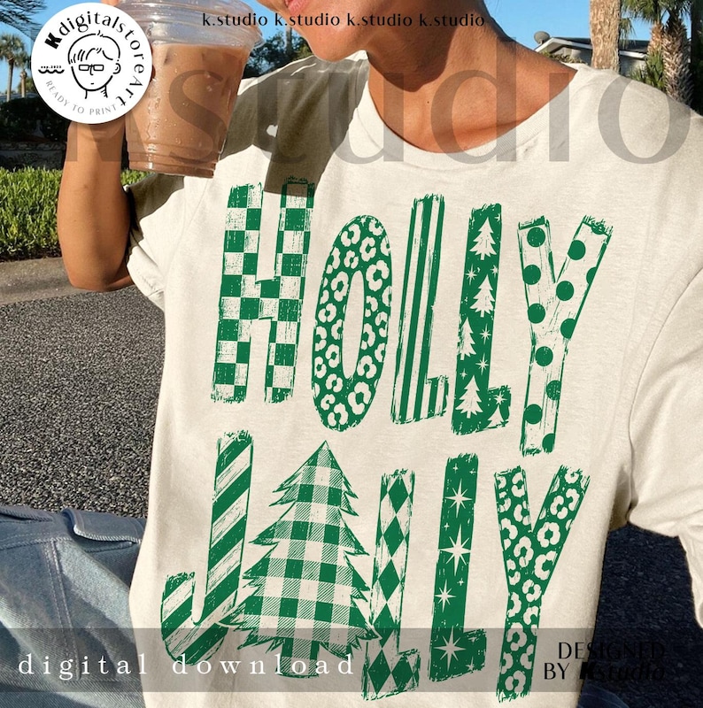 May include: A cream-colored t-shirt featuring the green text HOLLY JOLLY. The letters are filled with various patterns including checkers, leopard print, stripes, Christmas trees, polka dots, buffalo plaid, diamonds, and stars.