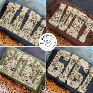 Puede incluir: Cuatro sudaderas en diferentes colores, cada una con un diseño único. Los diseños incluyen las palabras "MAYA", "AUNT", "MIMI" y "GIGI" en una fuente llena de una escena de patos y pantanos.