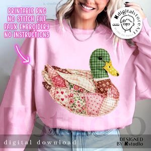 May include: Pink sweatshirt featuring a patchwork duck design with a green checkered head, a yellow beak, and a body made of various patterned fabrics. Text on the image reads "PRINTABLE PNG, NO STITCH FILE, FAUX EMBROIDERY, NO INSTRUCTIONS" and "digital download".