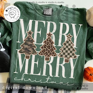 May include: A dark green t-shirt featuring the white text MERRY MERRY christmas. Three stylised Christmas tree graphics are centred, each with a different pattern: camouflage, leopard print, and a checkered design, all topped with a star.