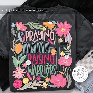 May include: A black t-shirt with a floral design and the text "Praying Mama Raising Warriors".