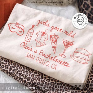 May include: A cream-colored tote bag with red illustrations and text. The design includes a sleep mask, bottle, pajamas, flowers, a cocktail, and pillows. Text reads "girls gone mild" and "Olivia's Bachelorette SAN DIEGO, CA".