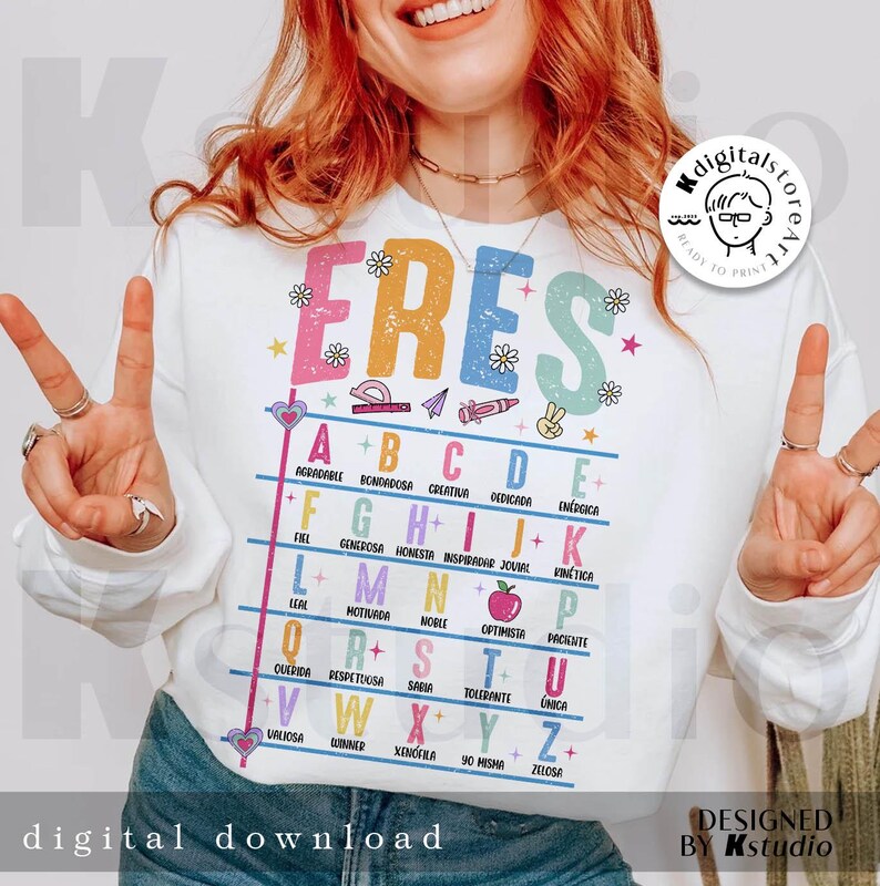 May include: White sweatshirt with the word "ERES" in colorful letters, with an alphabet chart below. The chart has words like "creative" and "energetic". The phrase "digital download" is at the bottom.