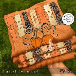 May include: Orange t-shirts stacked, featuring the word "TEACHER" in a mix of orange, tan, and leopard print. Two pumpkins with a bow are below the word. The text "DO NOT COPY" is visible. The words "DIGITAL DOWNLOAD" are at the bottom.