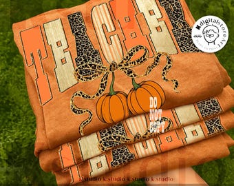 May include: Orange t-shirts stacked, featuring the word "TEACHER" in a mix of orange, tan, and leopard print. Two pumpkins with a bow are below the word. The text "DO NOT COPY" is visible. The words "DIGITAL DOWNLOAD" are at the bottom.