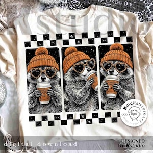 May include: Cream-colored t-shirt featuring three raccoon illustrations. Each raccoon wears an orange beanie, heart-shaped sunglasses, and holds a pumpkin spice latte. The shirt has a black and white checkered border and the words "digital download".