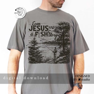 May include: A gray t-shirt with a black and white illustration of a man fishing. The text "Even Jesus Had a Fish Story" is printed on the shirt.
