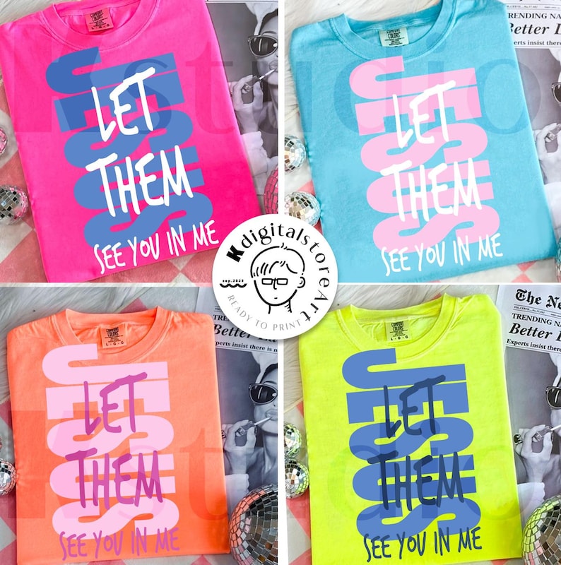 May include: Four colorful t-shirts: pink, blue, orange, and neon yellow. Each shirt features the text "LET THEM SEE YOU IN ME" in a contrasting color. The shirts are displayed with disco balls and a magazine.