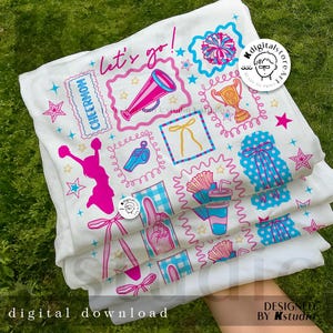 May include: White fabric with a repeating pattern of cheerleading-themed graphics in pink, blue, and yellow. The design includes megaphones, stars, bows, and the text "let's go!" and "CHEERMOM". The words "digital download" are also visible.