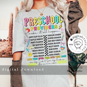 May include: A gray t-shirt with the text "PRESCHOOL PROVIDERS make it all happen" in colorful letters. The shirt features a list of tasks preschool providers do, such as "sippy cup fillin", "toddler chasin", "diaper changin", "boo boo kissin", "block buildin", "multi taskin", "tear wipin", "baby cuddlin", "song singin", and "book readin". The text "LOVE THEM SPOIL THEM GIVE THEM BACK" is written in a heart shape. The shirt also includes the text "Some days I rock it. Some days it rocks me. Either way we're rockin'" in a checkered pattern.