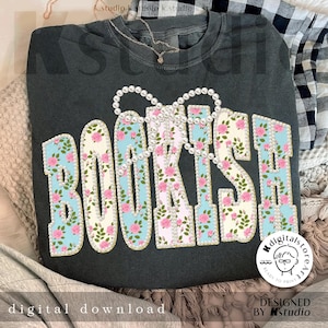 May include: Dark gray sweatshirt with the word "BOOKISH" in a floral design. The letters are outlined in gold and adorned with pink roses and pearls. The words "digital download" and "designed by Kstudio" are also visible.